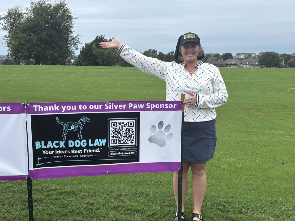 Kate Sullivan with Black Dog Law Silver Paw Sponsor banner at Lab Rescue OK Golf to the Rescue